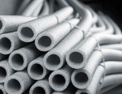 Foam pipe insulation for preventing frozen and burst pipes during winter, highlighting essential plumbing maintenance tips.